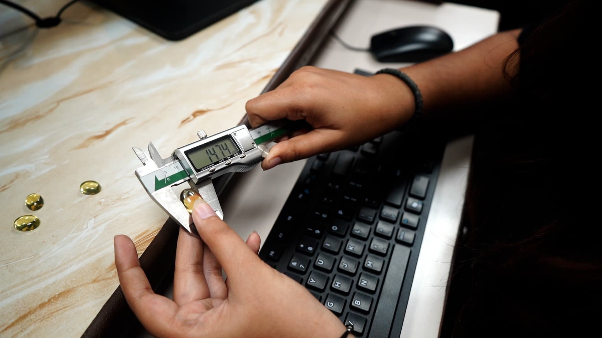Measuring a gemstone with digital calipers